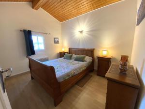 a bedroom with a bed and two night stands at Amaika karkula in Sare