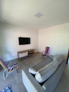 Μια τηλεόραση ή/και κέντρο ψυχαγωγίας στο Apartamento Exclusivo Inteiro perto da Vila - Barra Grande Beach Stay +24 φωτογραφίες