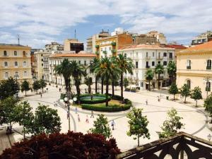 a view of a city with palm trees and buildings at Casa Roberta in Taranto