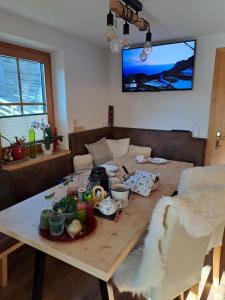 a table with food on it in a living room at Seilhof in Ennsling