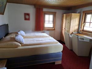 a bedroom with a bed and a window at Seilhof in Ennsling +29 photos