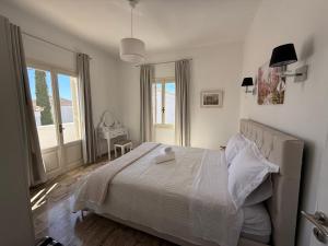 Postel nebo postele na pokoji v ubytování Casa Irida