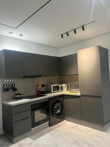 Kuchyň nebo kuchyňský kout v ubytování Naturalia Appart & Hotel - Casa Center + 15 fotografií