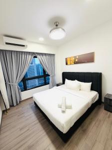 Postel nebo postele na pokoji v ubytování Agile Bukit Bintang Trx By RnR