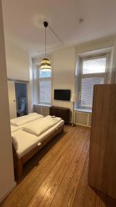 Postel nebo postele na pokoji v ubytování Ostsee Hotel Lübeck