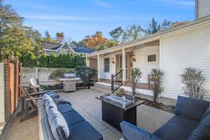 a patio with a couch and a table at Northgate in Saugatuck
