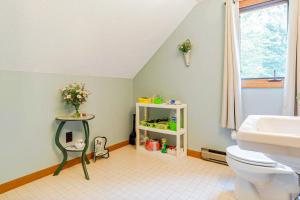 a bathroom with a toilet and a sink at Moose’in Around in Sweden +22 photos