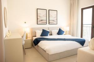 Ένα ή περισσότερα κρεβάτια σε δωμάτιο στο Premium Studio in Yas Golf Collection