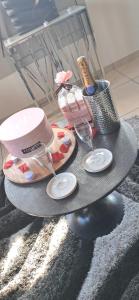 a table with two wine glasses and a blender at GlamappartSpa Prestige New-York expérience in Reims