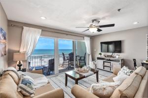 a living room with a view of the ocean at Commodore's Retreat 305 in Seagrove Beach