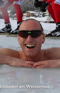 a man with sunglasses on his face in the water at SeeHotel & SeeApartments Kärntnerhof- direkt am See! in Weissensee