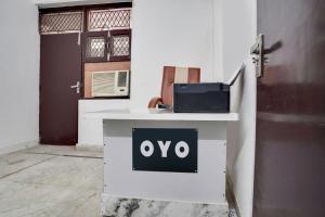 a white desk with an oo sign on it at Hotel O Royal residency in Dera Māndi