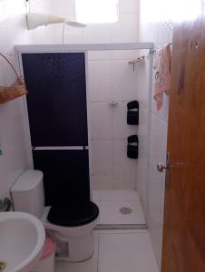 a bathroom with a shower with a toilet and a sink at Lar caprichoso in Aracaju +12 photos