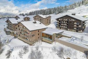 an aerial view of a resort in the snow at Résidence Club MMV Les Chalets des Cimes in Les Saisies