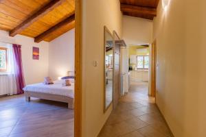 a bedroom with a bed and a hallway at Villa Mainenti in Višnjan +29 photos