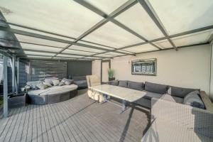 a living room with a couch and a table at Villa am Staderhof in Leichlingen