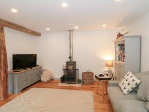 Televiisor ja/või meelelahutuskeskus majutusasutuses The Threshing Barn