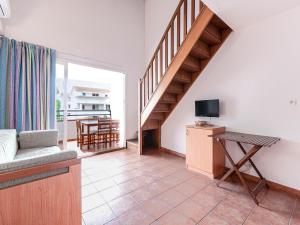 TV a/nebo společenská místnost v ubytování Vacancéole - Résidence Sognu di Rena