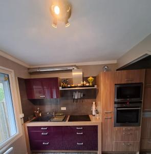 a kitchen with a sink and a stove top oven at Villa touquettoise near the sea in Le Touquet-Paris-Plage