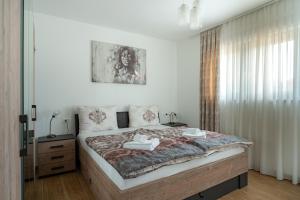 Postel nebo postele na pokoji v ubytování Ville Novak Villaggio by Adex Travel + 49 fotografií