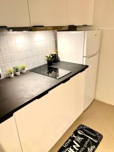 Η κουζίνα ή μικρή κουζίνα στο Woodstock IX, self check-in