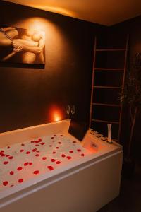 a bedroom with a bed with red hearts on it at Aphrodite House in Guebwiller