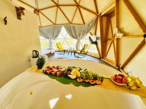 a tray of fruit on the edge of a tub at In Out in Antalya