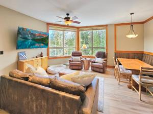 a living room with a couch and a table at Timberline Lodges by Fernie Lodging Co in Fernie