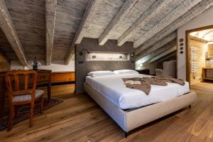 Giường trong phòng chung tại La Maison du Sucre