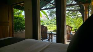 Postel nebo postele na pokoji v ubytování Sigiri Close-up View Guest