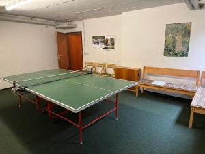 a room with a ping pong table in it at Ferienwohnung Sunnabichi in Wertach +33 photos
