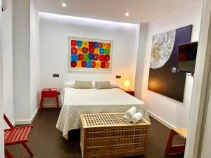 En eller flere senge i et værelse på Casa Juanes