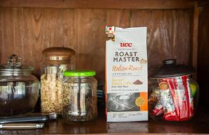 a shelf with jars of food and a box of pasta at Teak House Homestay I in Ban Thung Satong +33 photos