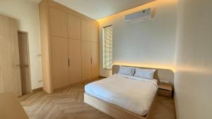 Ένα ή περισσότερα κρεβάτια σε δωμάτιο στο Minimalistic Pool Villa