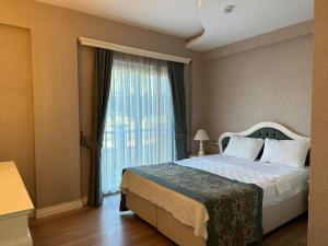 Postel nebo postele na pokoji v ubytování Defne Beach Karya