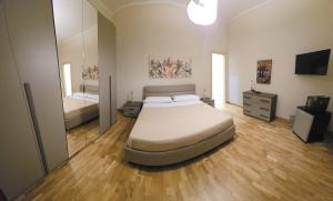 Ένα ή περισσότερα κρεβάτια σε δωμάτιο στο La Casa di MaMA