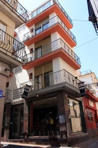 a building with balconies on the side of it at Casa Don Juan in Benidorm