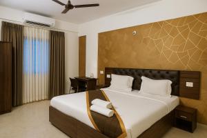 Postel nebo postele na pokoji v ubytování Sai Bliss International, Manyata Tech Park + 51 fotografií