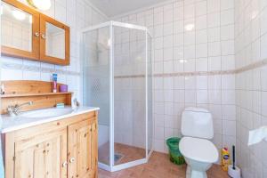 a bathroom with a shower and a toilet and a sink at VGO822-Fjaeras-Grimmeredsvaegen-35 in Ubbhult +20 photos