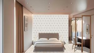 Un dormitorio con una cama, una mesa y una silla. en Hotel Costa Azzurra, en Grado