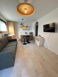 a living room with a couch and a table at St Paul de Vence in Cagnes-sur-Mer