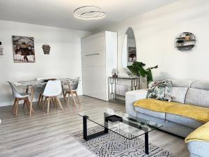 a living room with a couch and a table at Paradistay in Cannes