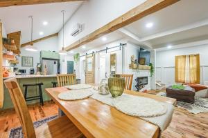 a kitchen and dining room with a wooden table at Charming Cabin with Hot Tub, Fireplace, Fire Pit, 2 minutes to downtown in Ellijay