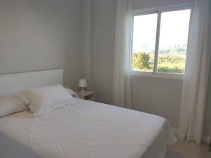 Postel nebo postele na pokoji v ubytování Ático con vistas en Salobreña