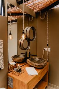 a kitchen with two sinks on a wooden table at Element Quindío in Boquía +28 photos