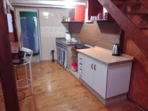 a kitchen with a stove and a counter top at El Nido in Sauce Viejo +1 photo