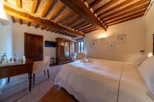 Ένα ή περισσότερα κρεβάτια σε δωμάτιο στο Antico Borgo Delle Rose