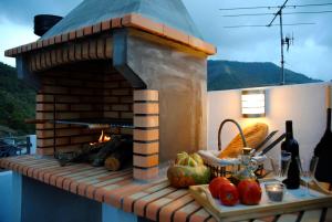 a brick oven sitting on top of a patio at Can Pitu in Alfondeguilla