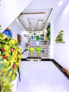 a living room with a pool in a house at Hoàng Nga 2 Homestay in Phan Thiet