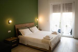 Postel nebo postele na pokoji v ubytování Casa Pemogi